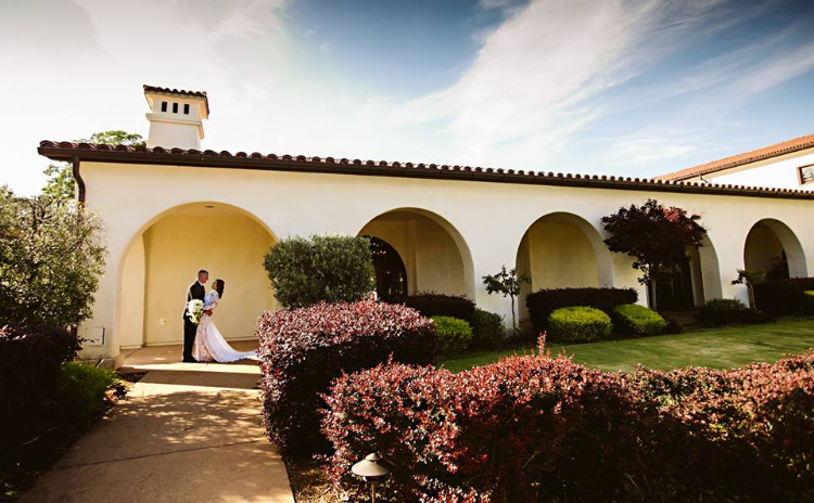 bride and groom in golf course clubhouse loggia